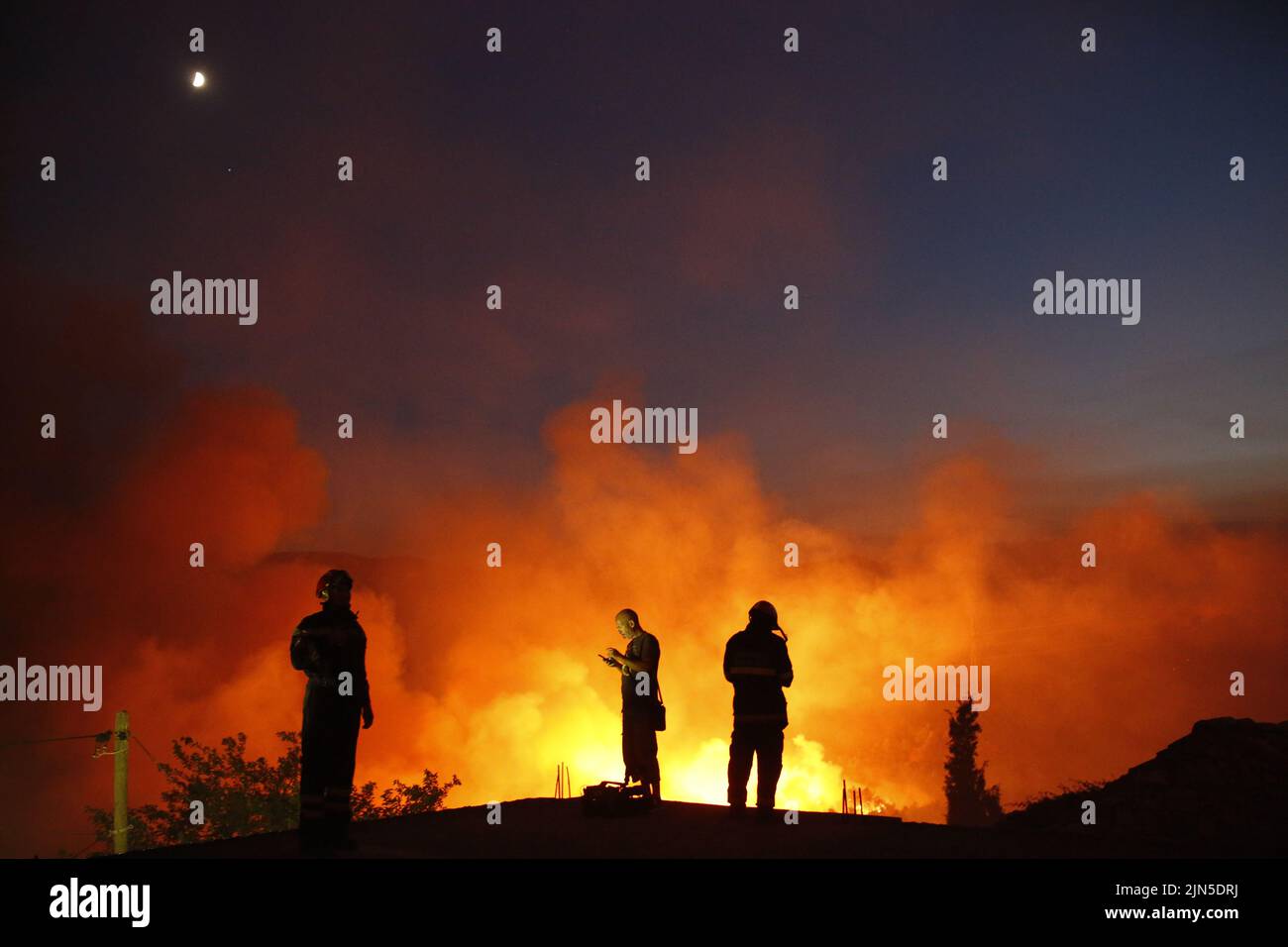 Croatian fire workers controls fire during forest fire  on the Peljesec peninsula in southern part of Croatia. Stock Photo