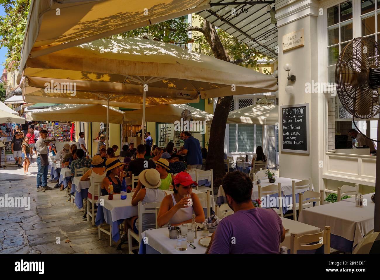 tourists enjoying lunch in the Plaka area of Athens Stock Photo