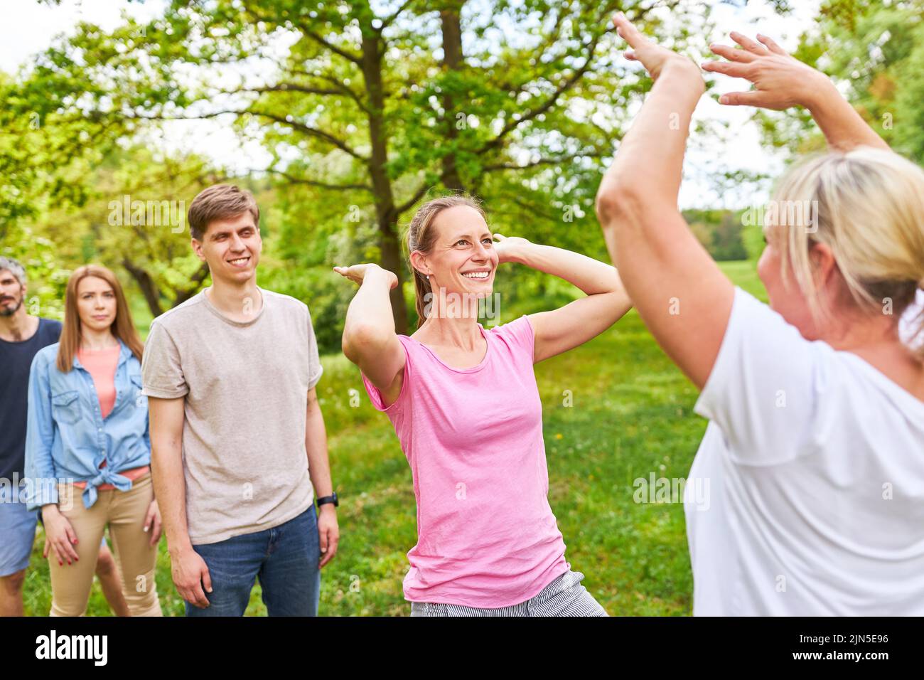 Young people giving high fives after winning a competition or for motivation Stock Photo