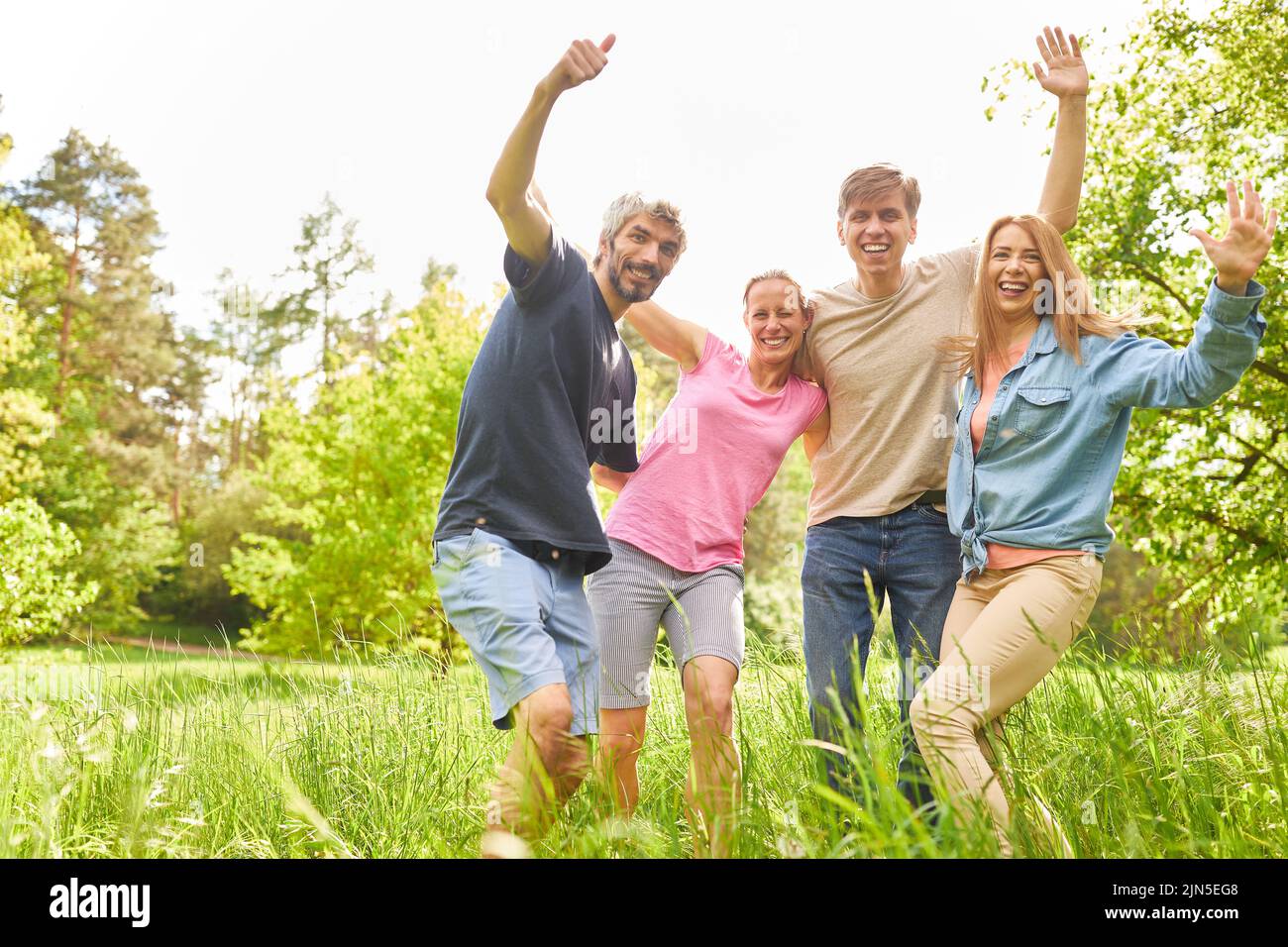 Group of friends as a happy community in nature for enthusiasm and joie de vivre Stock Photo