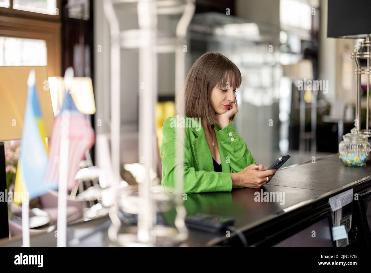 Business woman at hotel reception Stock Photo