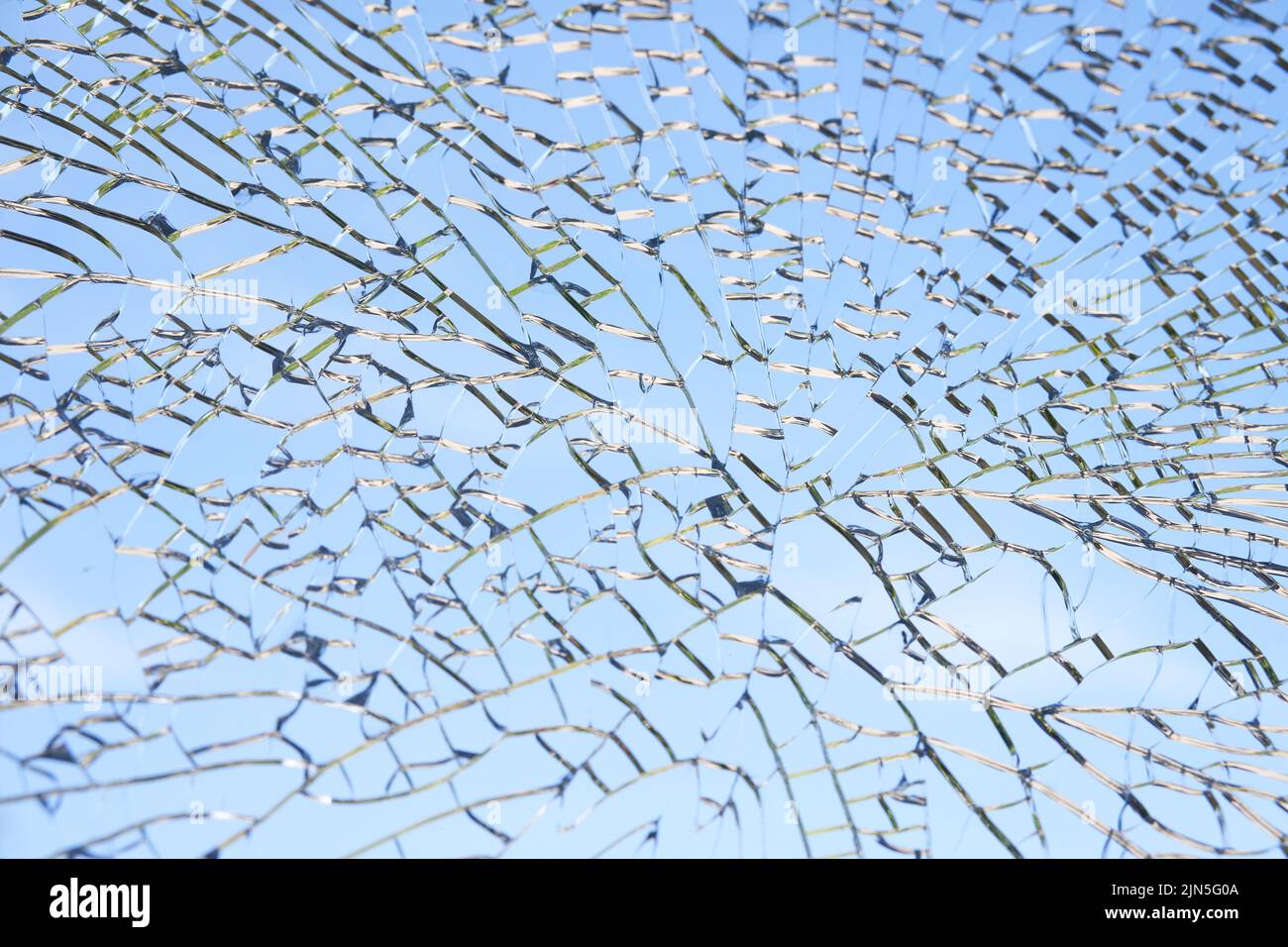 A large pane of safety glass in a patio door that has spontaneously