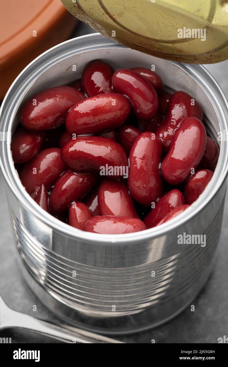 Open tin can with preserved  kidney beans isolated on white background Stock Photo