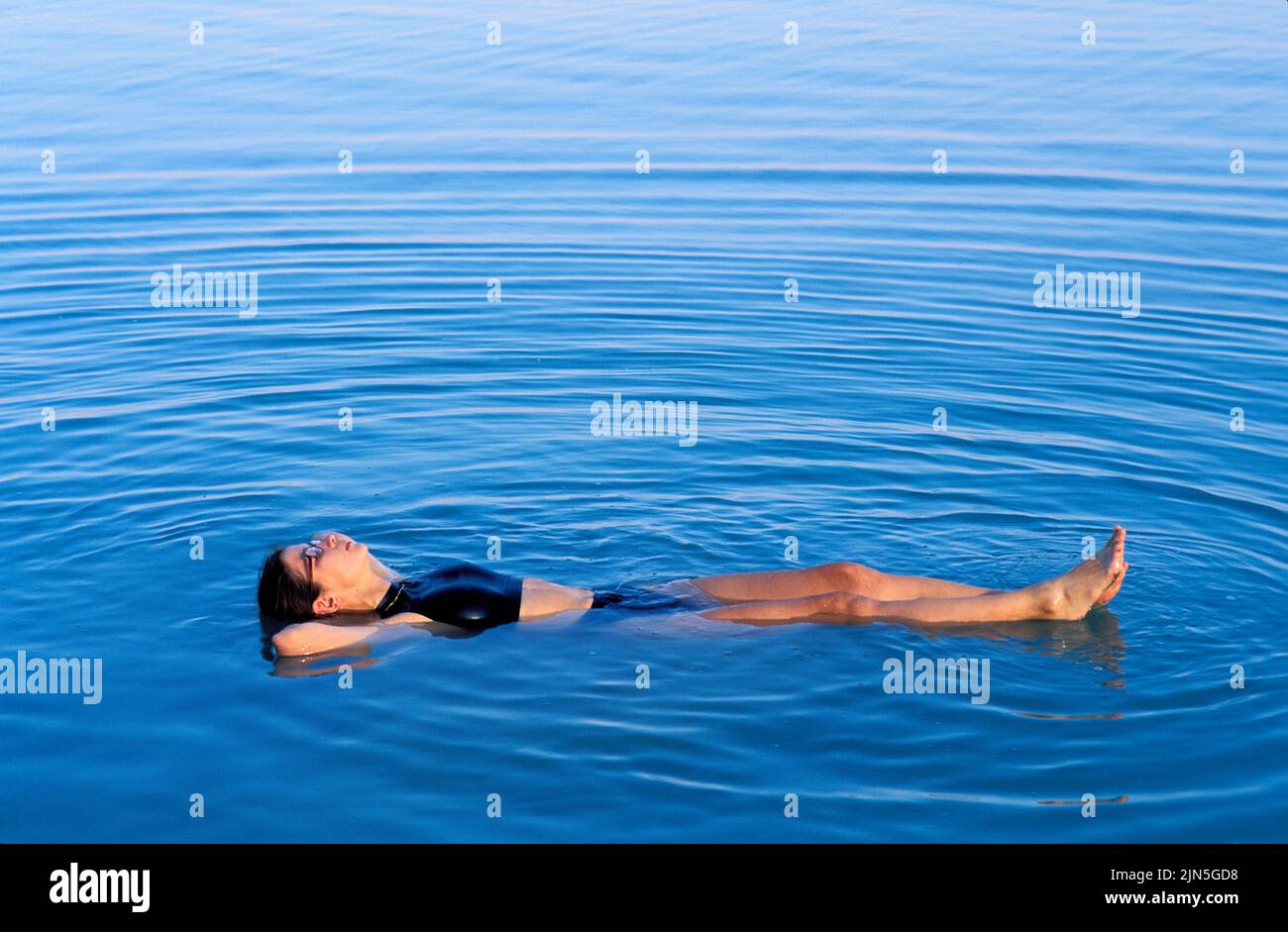 Jordan, woman taking a bath on the Dead Sea Stock Photo