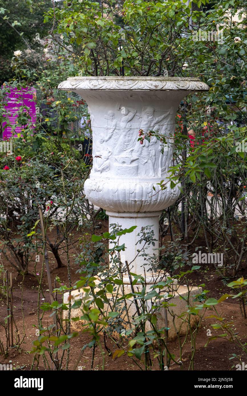 A vertical shot of a white vase with engravings in Casa das Rosas, Sao Paulo, Brazil Stock Photo