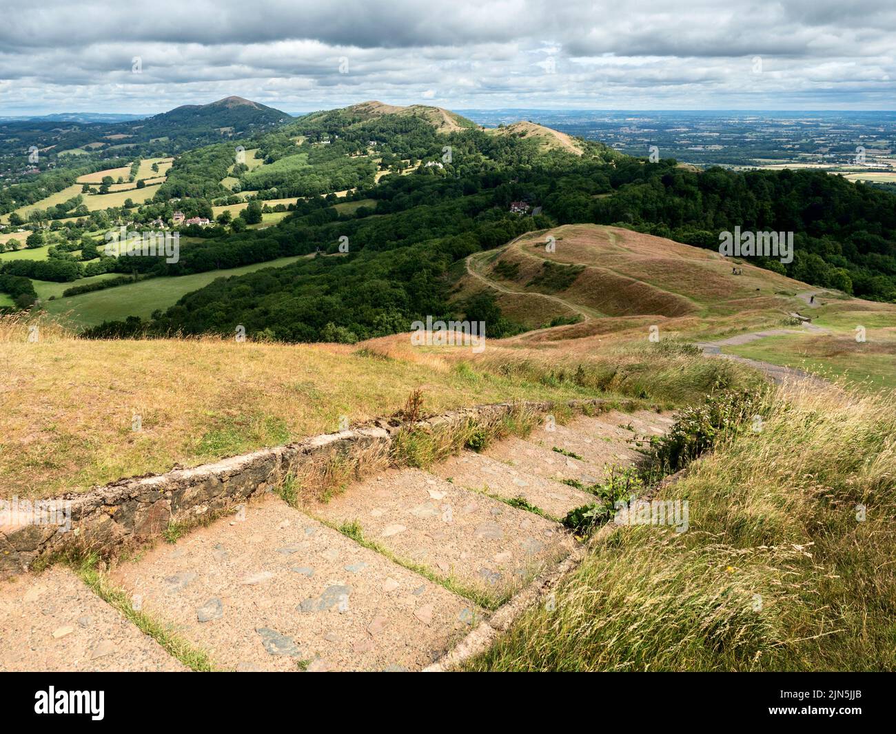 View along the ridge of the Malvern Hills from the summit of Herefordshire Beacon or British Camp Malvern Hills AONB England Stock Photo
