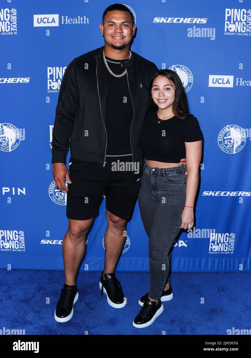 ELYSIAN PARK, LOS ANGELES, CALIFORNIA, USA - AUGUST 08: Venezuelan professional baseball pitcher for the Los Angeles Dodgers of Major League Baseball Brusdar Graterol and wife Allison Landa arrive at Kershaw's Challenge Ping Pong 4 Purpose 2022 held at Dodger Stadium on August 8, 2022 in Elysian Park, Los Angeles, California, United States. (Photo by Xavier Collin/Image Press Agency) Stock Photo