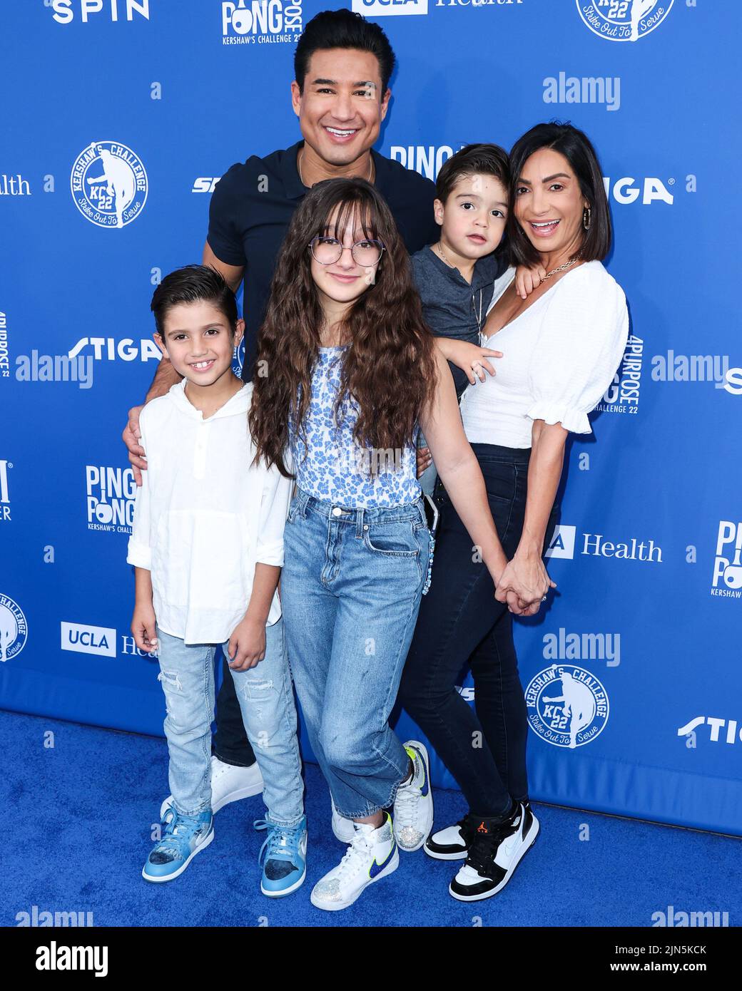 ELYSIAN PARK, LOS ANGELES, CALIFORNIA, USA - AUGUST 08: American actor and television host Mario Lopez, wife/American actress Courtney Laine Mazza, daughter Gia Francesca Lopez, son Santino Rafael Lopez and son Dominic Lopez arrive at Kershaw's Challenge Ping Pong 4 Purpose 2022 held at Dodger Stadium on August 8, 2022 in Elysian Park, Los Angeles, California, United States. (Photo by Xavier Collin/Image Press Agency) Stock Photo