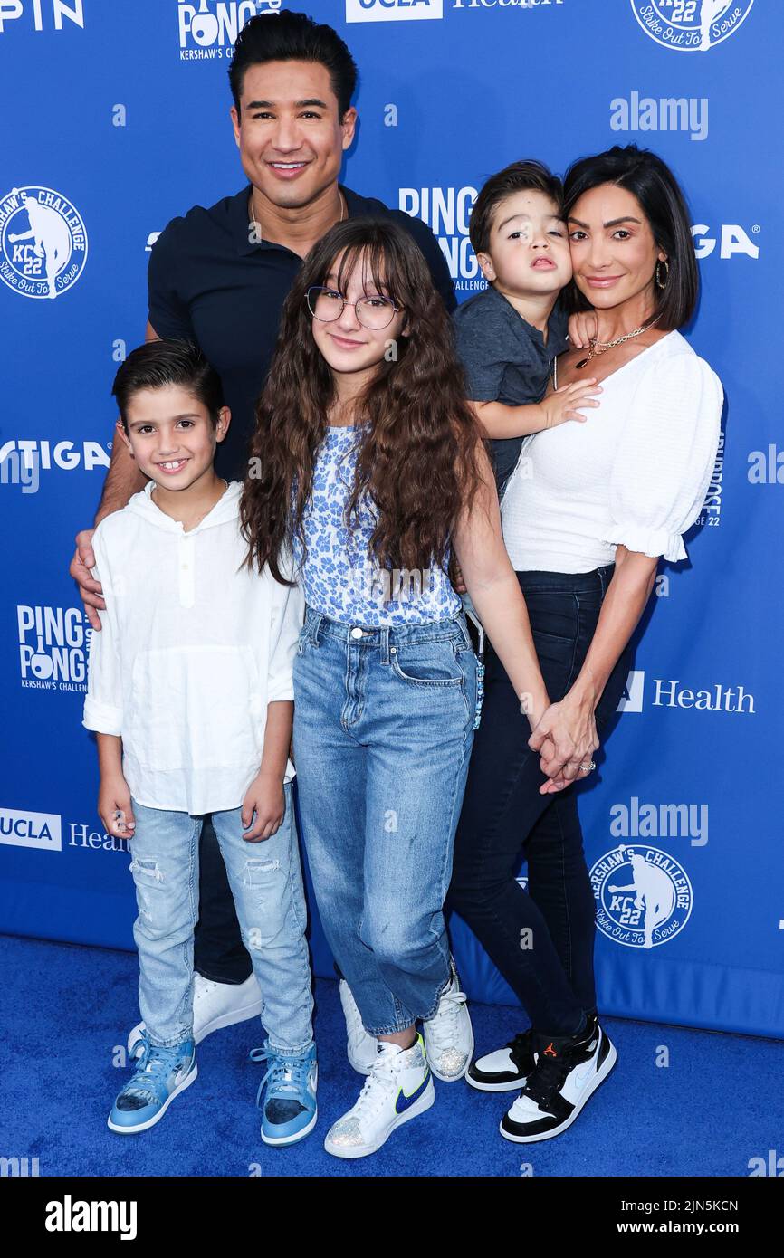 ELYSIAN PARK, LOS ANGELES, CALIFORNIA, USA - AUGUST 08: American actor and television host Mario Lopez, wife/American actress Courtney Laine Mazza, daughter Gia Francesca Lopez, son Santino Rafael Lopez and son Dominic Lopez arrive at Kershaw's Challenge Ping Pong 4 Purpose 2022 held at Dodger Stadium on August 8, 2022 in Elysian Park, Los Angeles, California, United States. (Photo by Xavier Collin/Image Press Agency) Stock Photo