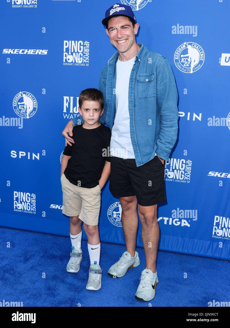 Los Angeles, United States. 08th Aug, 2022. ELYSIAN PARK, LOS ANGELES, CALIFORNIA, USA - AUGUST 08: Ozzie James Greenfield and father/American actor Max Greenfield arrive at Kershaw's Challenge Ping Pong 4 Purpose 2022 held at Dodger Stadium on August 8, 2022 in Elysian Park, Los Angeles, California, United States. (Photo by Xavier Collin/Image Press Agency) Credit: Image Press Agency/Alamy Live News Stock Photo