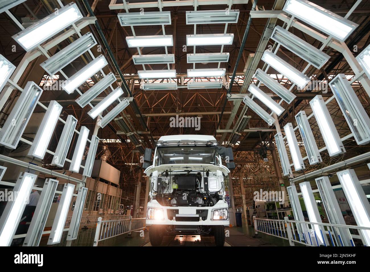 Xi'an, China's Shaanxi Province. 24th May, 2022. A truck waits for inspection after it is assembled at Shaanxi Automobile Holding Group in Xi'an, capital of northwest China's Shaanxi Province, May 24, 2022. Credit: Li Yibo/Xinhua/Alamy Live News Stock Photo