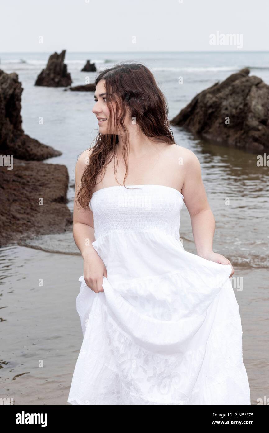 woman in white dress on the beach Stock Photo Alamy — free download