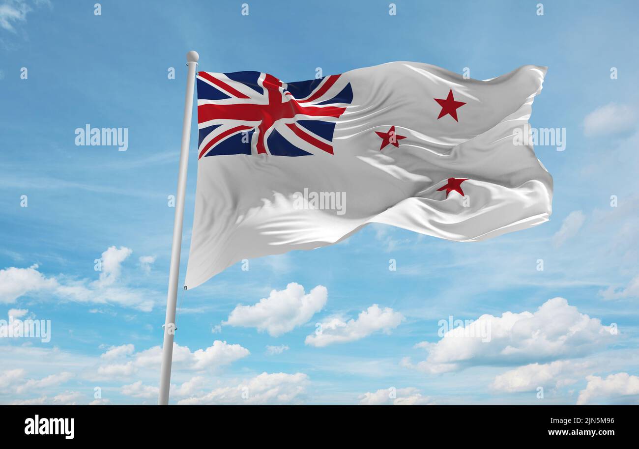 Official Flag Of Naval Ensign New Zealand At Cloudy Sky Background On official-flag-of-naval-ensign-new-zealand-at-cloudy-sky-background-on