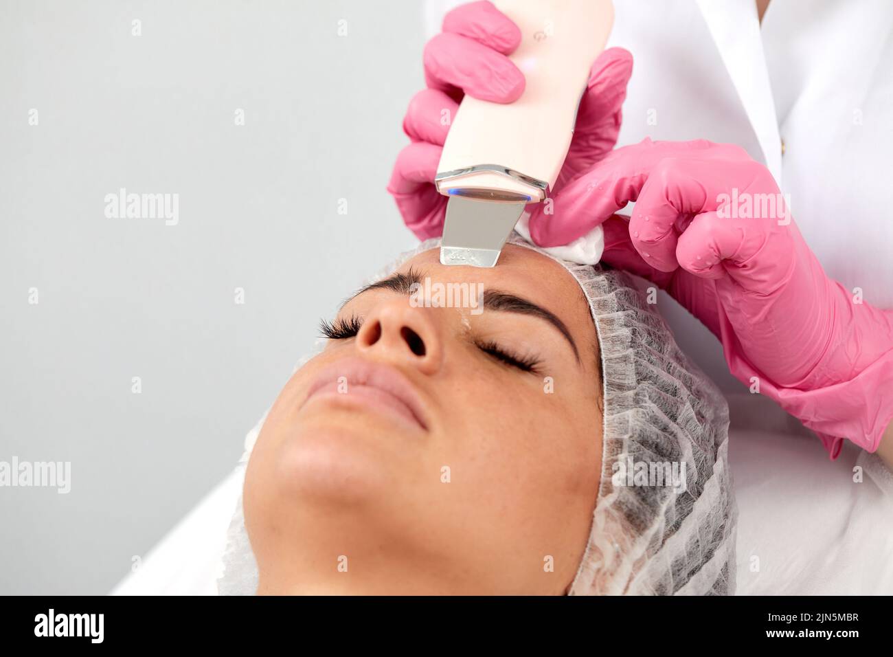Skin Care. Closeup Of Beautiful Woman Receiving Ultrasound Cavitation