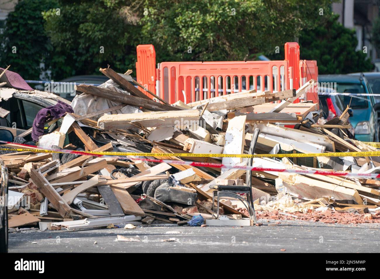 General view debris at the scene of an explosion on Galpin's Road in Thornton Heath, south London. The London Ambulance Service has confirmed a child has died and three people are in hospital after the terraced home collapsed following an explosion and fire on Monday. Picture date: Tuesday August 9, 2022. Stock Photo