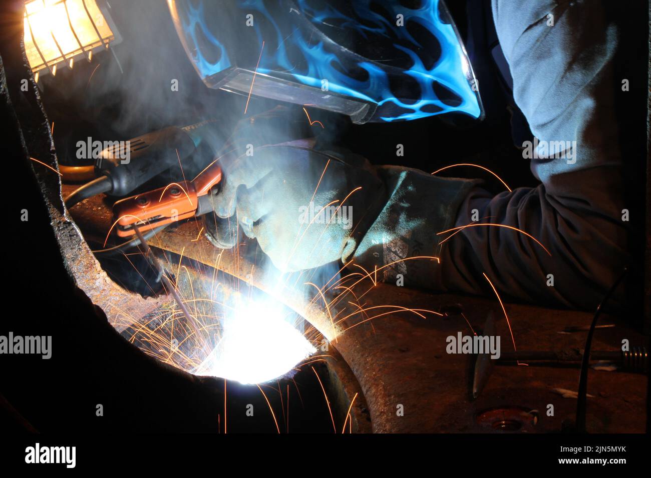 welding repair with sparks flying Stock Photo Alamy