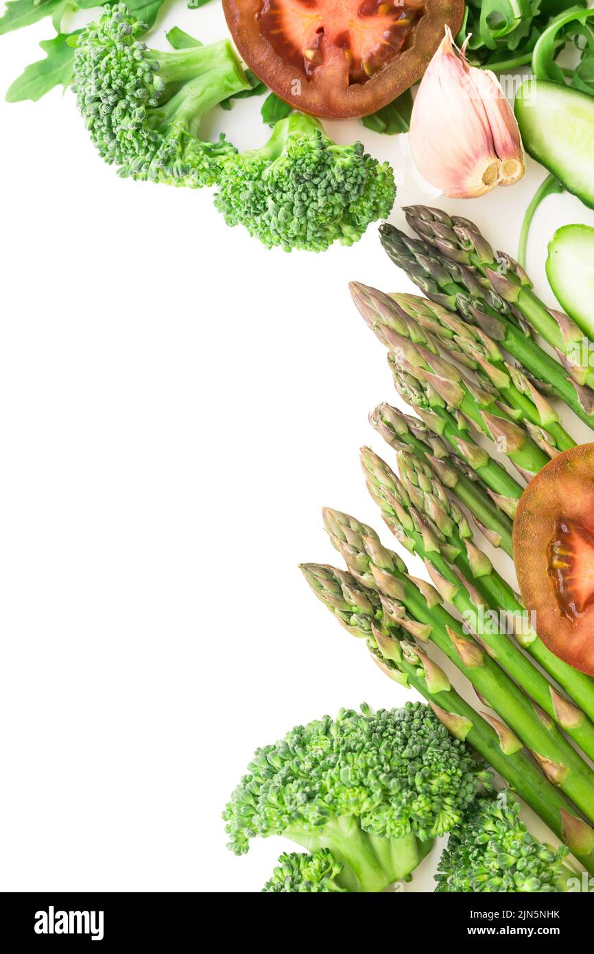 frame of green vegetables broccoli, arugula, cucumber, asparagus ...