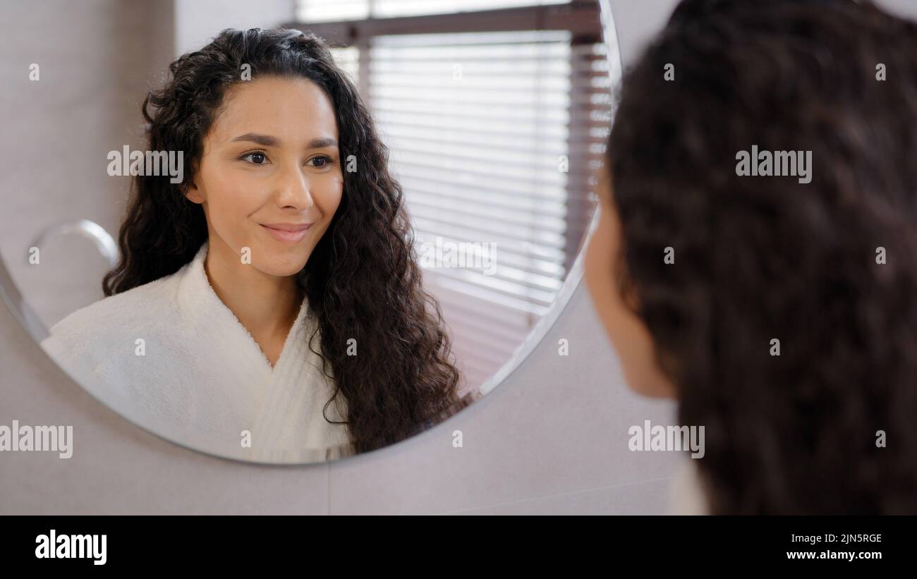 Woman looking in mirror hi-res stock photography and images - Alamy