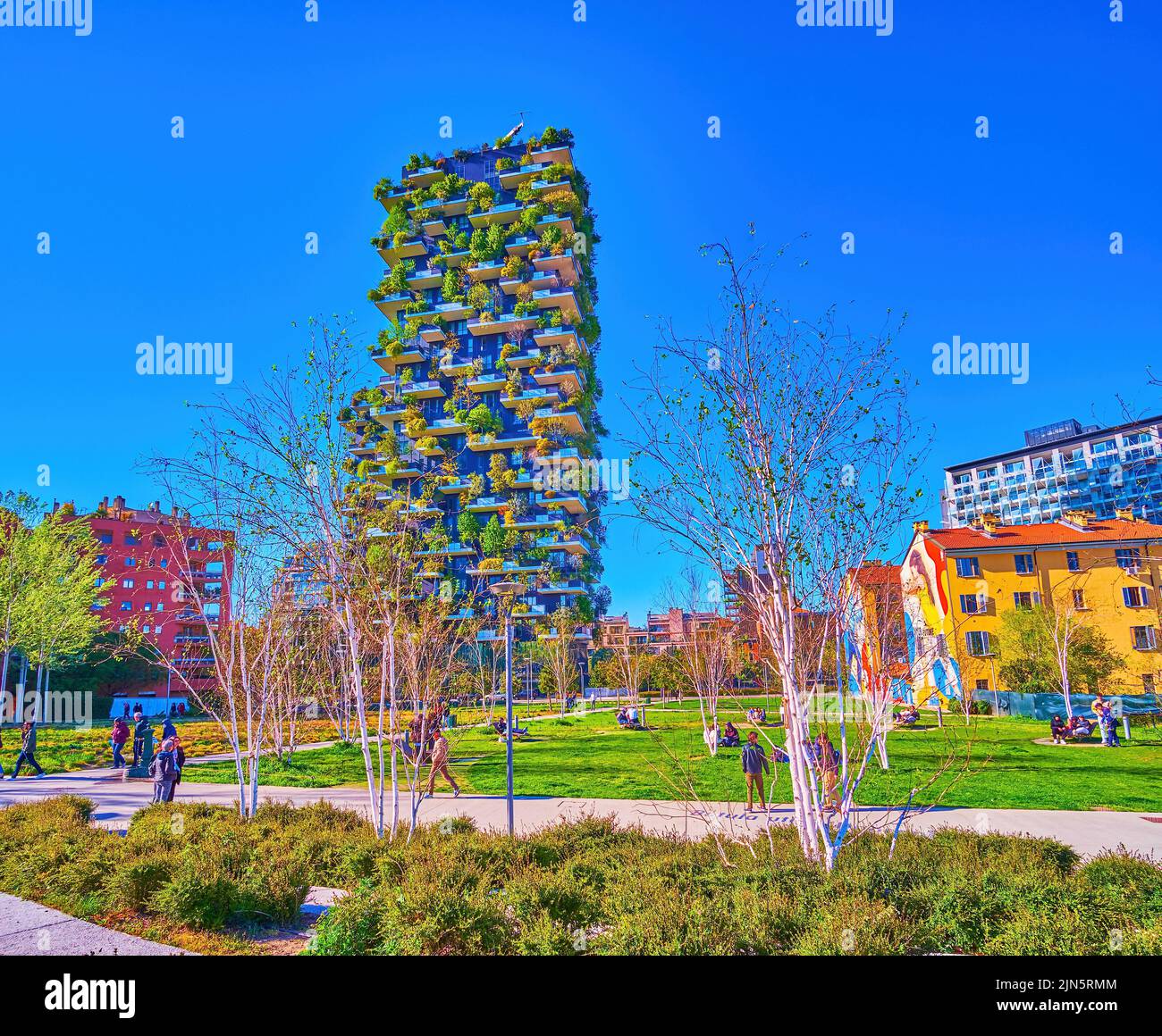 MILAN, ITALY - APRIL 9, 2022: Biblioteca degli Alberi Park is one of the largest in the city and boasts great views on Vertical Forest buildings, on A Stock Photo
