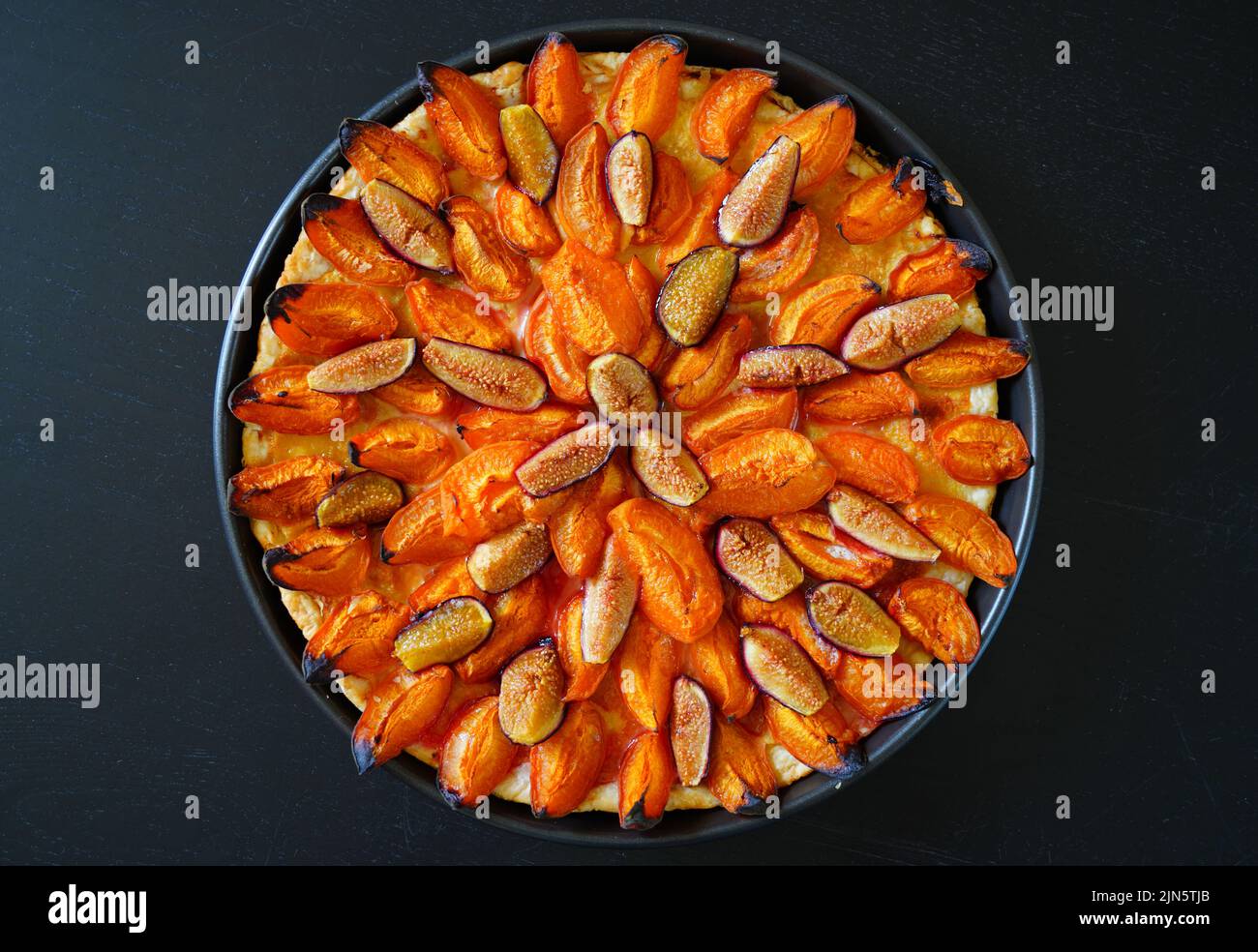 Homemade tart with apricots, figs and almonds Stock Photo