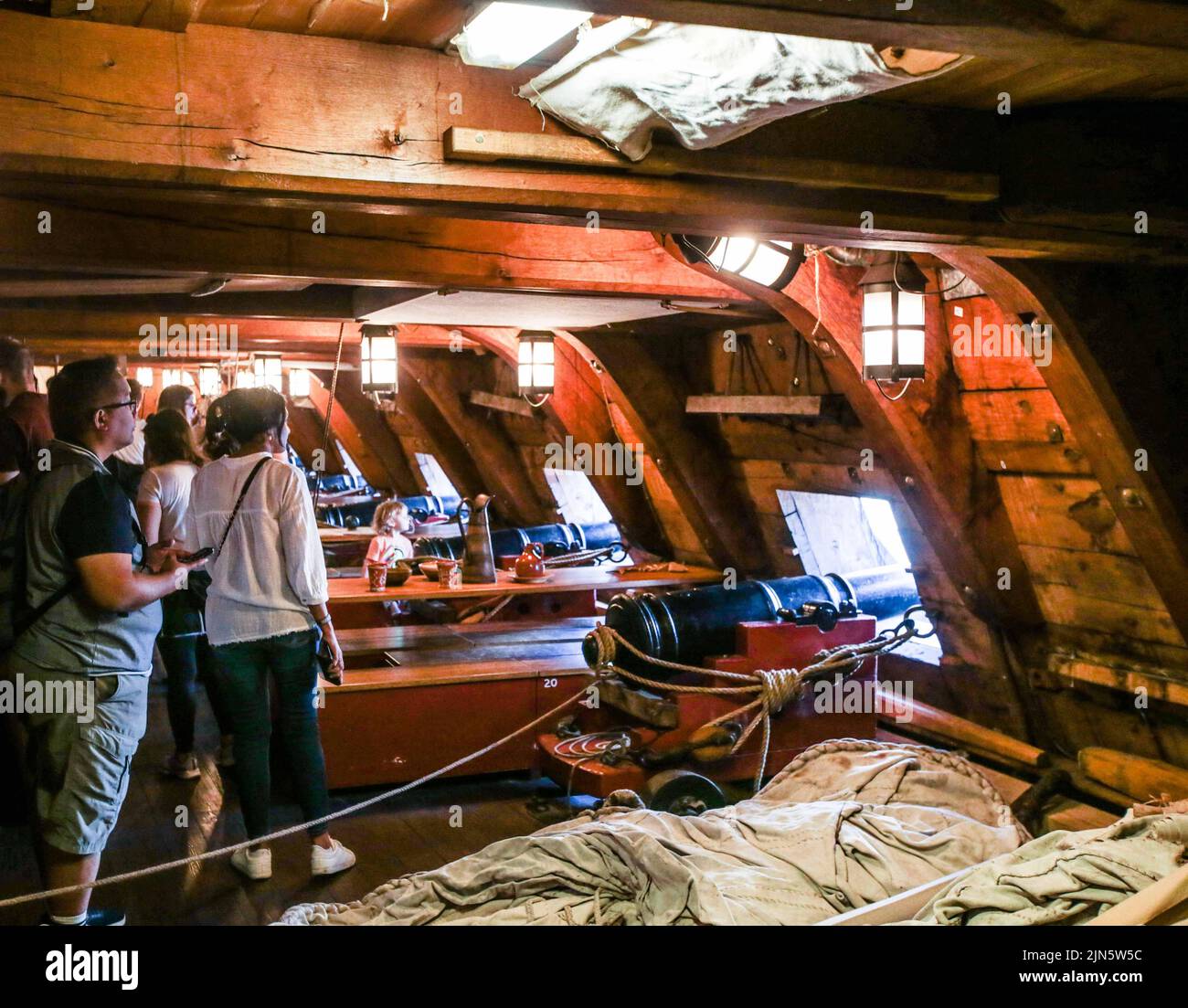 London UK 9 August 2022 The cannon gallery  besides the tables were the crew  eat and sleep in hammoks.Open to visitors every day until 12 of August  Paul Quezada-Neiman/Alamy Live News Stock Photo