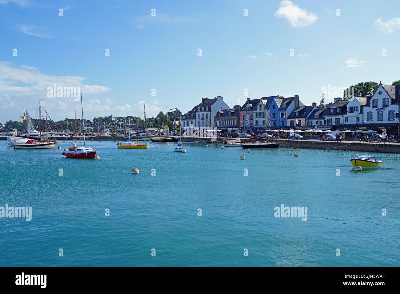 LA-TRINITE-SUR-MER, FRANCE -7 AUG 2021- View of boats in the harbor of La Trinite sur Mer, a pleasure boats harbor on the Bay of Quiberon in Morbihan, Stock Photo