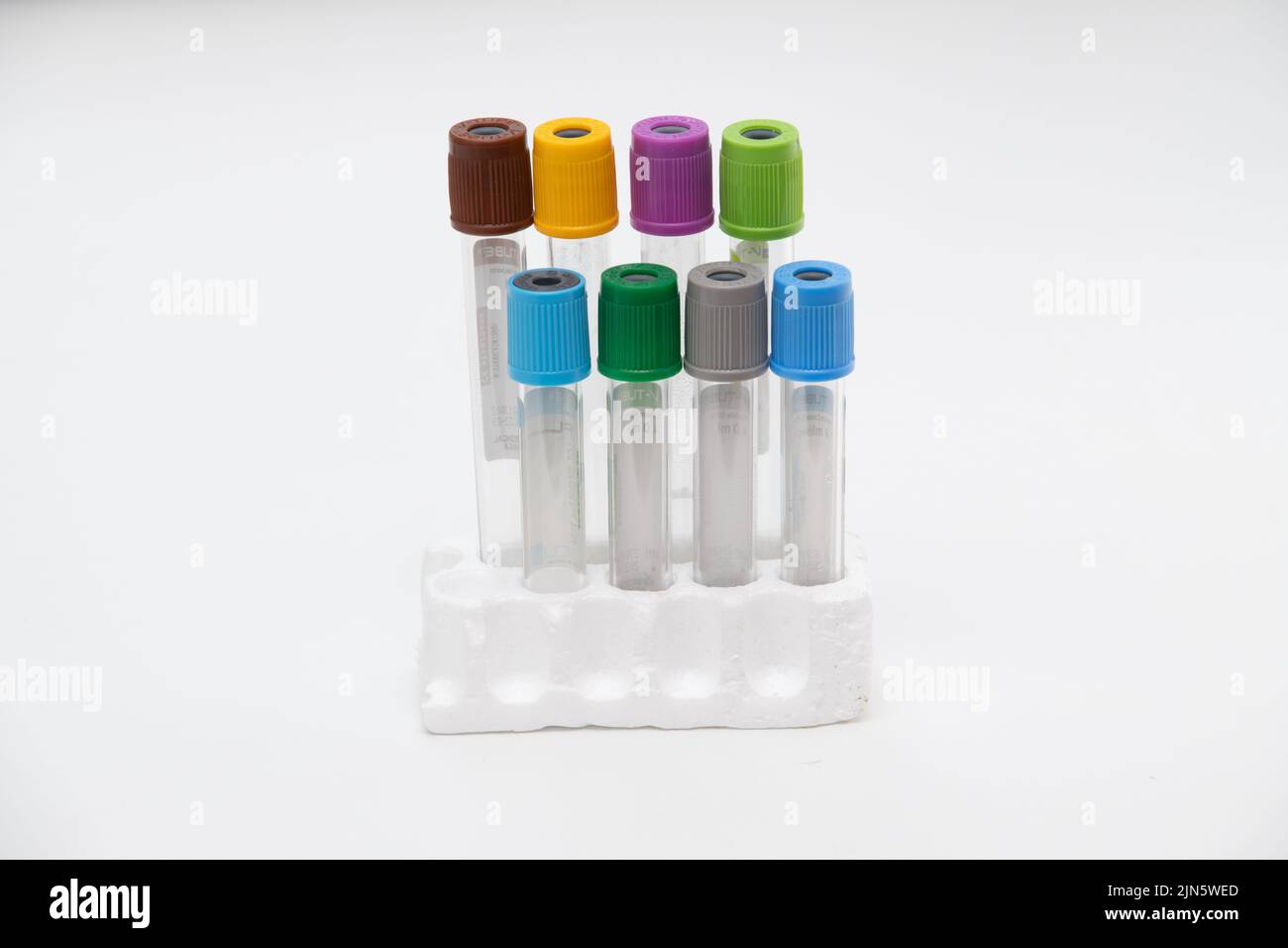 Two vacuum tubes for collection blood samples witn christmas three on