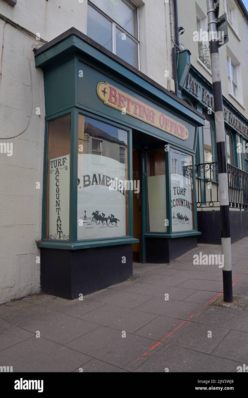 A traditional shopfront of the P Bambury betting shop in Mallow, County Cork, Ireland, July 2022 Stock Photo