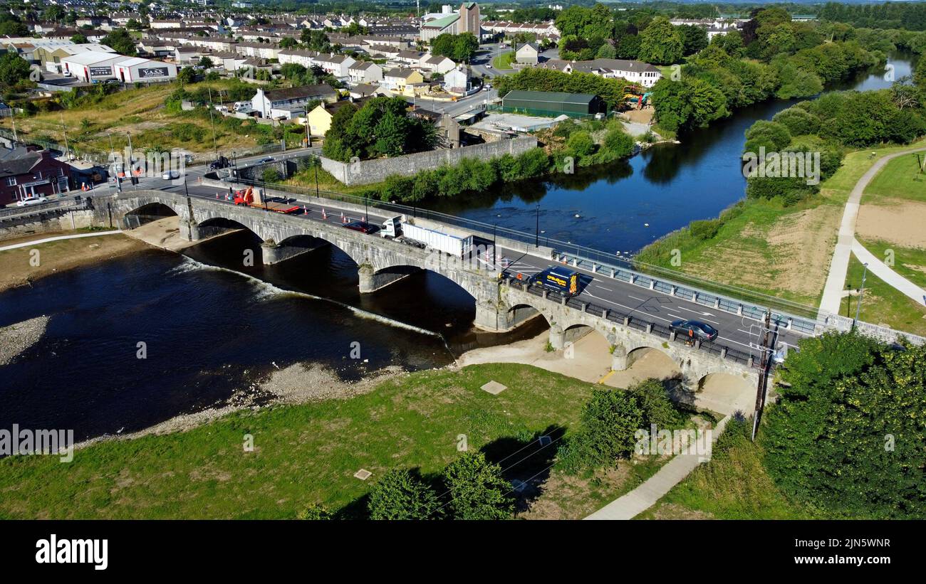 An Aerial view of the River Blackwater and the bridge carrying the R620 road through the town of Mallow, County Cork, Ireland. looking West. July 2022 Stock Photo