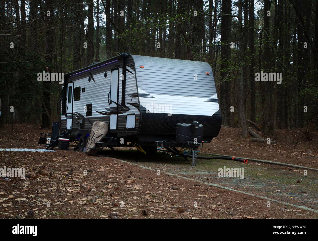Camping trailer that is whte with black and gray at Jordan Lake in North Carolina Stock Photo