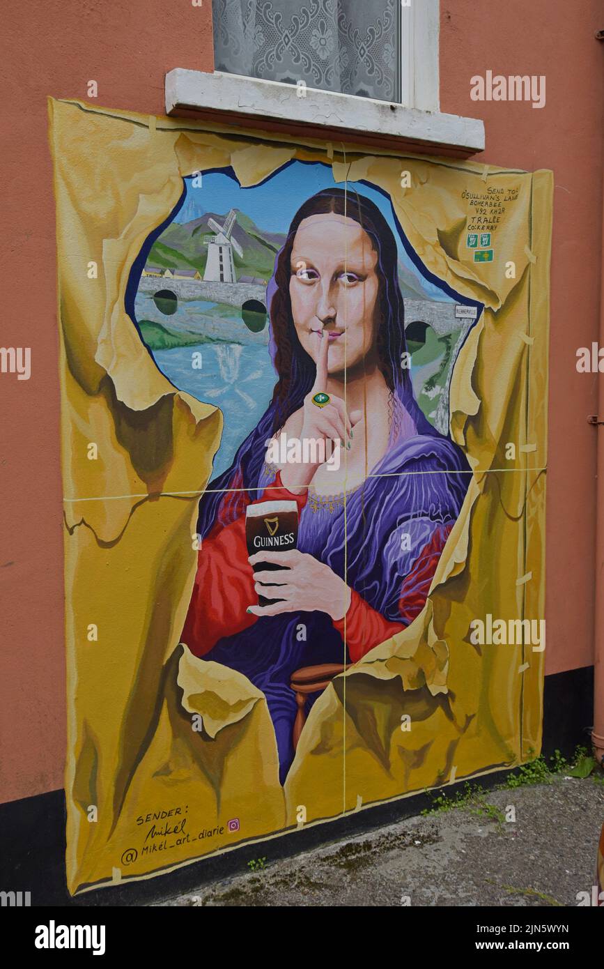 A parody mural of the Mona Lisa featuring Guinness on the outside wall of the Slievemish Bar, Tralee, County Kerry, Ireland Stock Photo