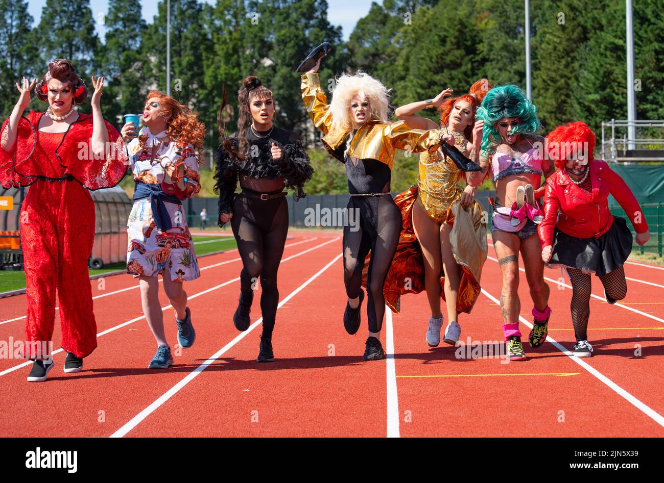 Edinburgh, Scotland, UK. 9th August 2022.  Drag queens from several shows performing as part of the Edinburgh Fringe 2022 Toake part in a Drag Race on the running track at the redeveloped Meadowbank stadium in Edinburgh today. From left;  Kate Butch, Dixie Longate, Nastia, Enter Serenity, Belle Du Ball,  Captain Kidd, Crudi Dench. Iain Masterton/Alamy Live News Stock Photo