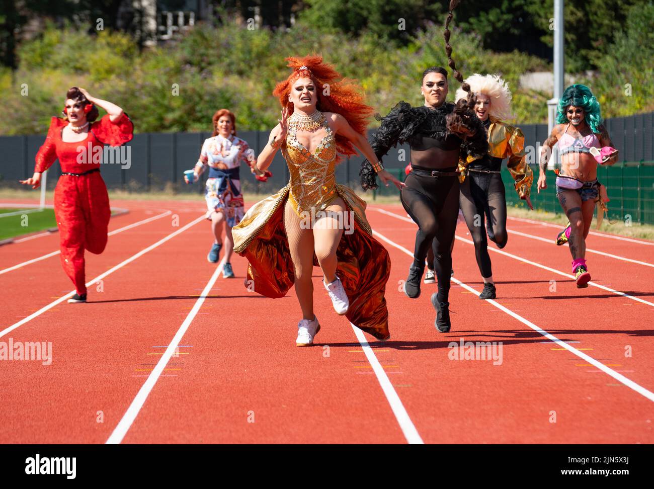 Edinburgh, Scotland, UK. 9th August 2022.  Drag queens from several shows performing as part of the Edinburgh Fringe 2022 Toake part in a Drag Race on the running track at the redeveloped Meadowbank stadium in Edinburgh today. From the left; Kate Butch, Dixie Longate, Belle Du Ball, Nastia, Enter Serenity, Captain Kidd.  Iain Masterton/Alamy Live News Stock Photo
