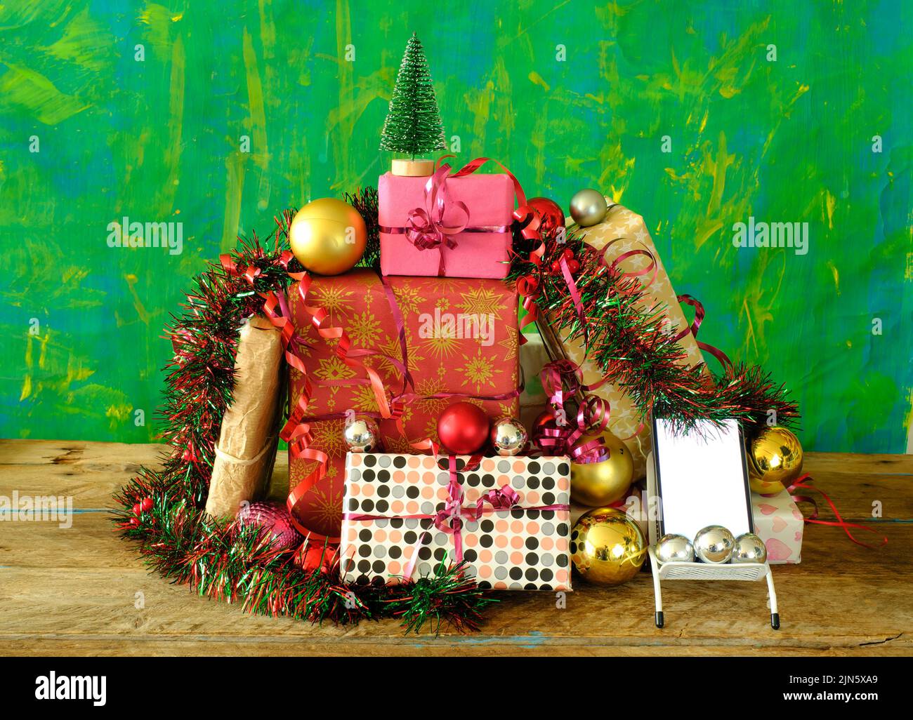 Christmas shopping online.Buying New year presents using smartphone.Gift boxes and phone.Free copy space Stock Photo