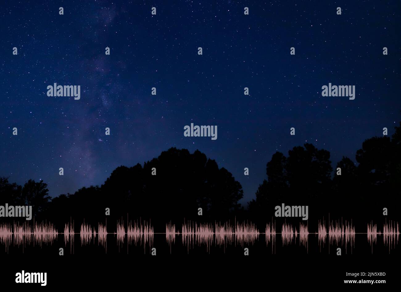 Radio signal in the night with a sky filled with stars and the Milky Way Stock Photo