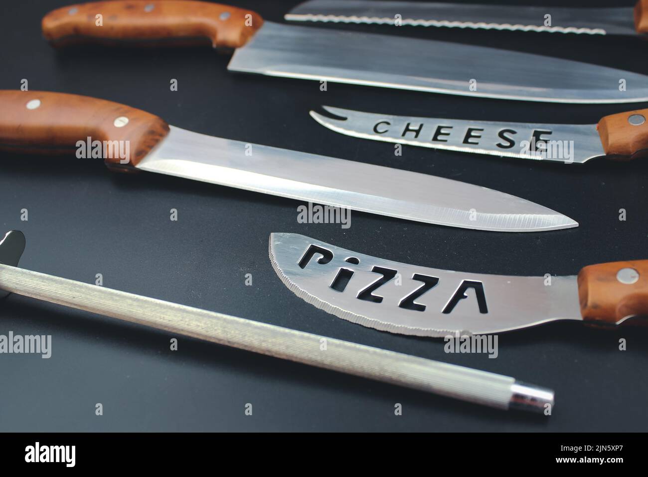 Close up of good set of kitchen knives for slicing. Set of steel kitchen knives. Stock Photo