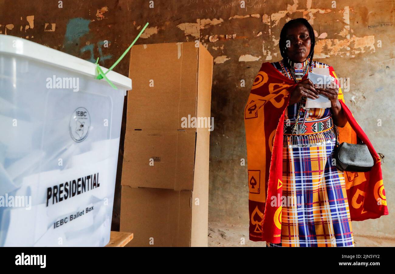 A Maasai traditional woman walks from a voting booth at a polling centre after casting her ballot during the general election by the Independent Electoral and Boundaries Commission (IEBC) in Ewaso Kedong primary school in Kajiado county, Kenya August 9, 2022. REUTERS/Thomas Mukoya Stock Photo