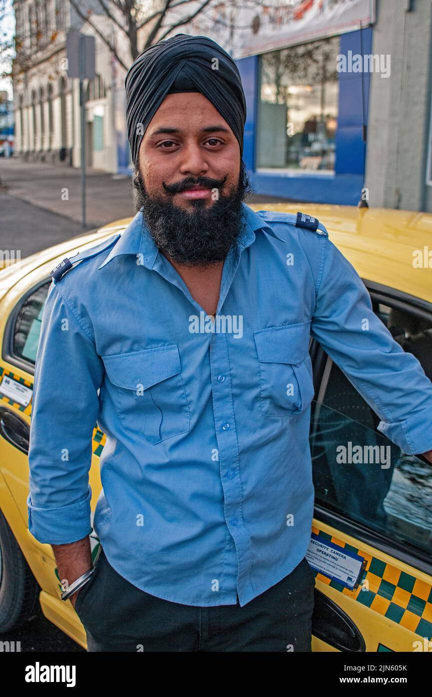 Baghwant Singh, Silver Top Cab Service driver photographed with his cab in Elizabeth Street, Melbourne Stock Photo