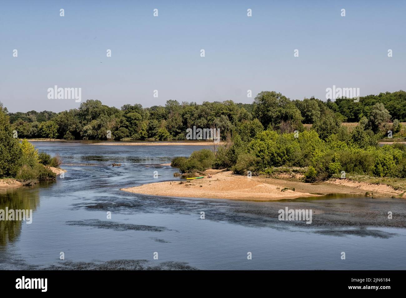 People with canoes relaxing on a sandbank in the Loire river  in the Saone et Loire department. France, Europe Stock Photo