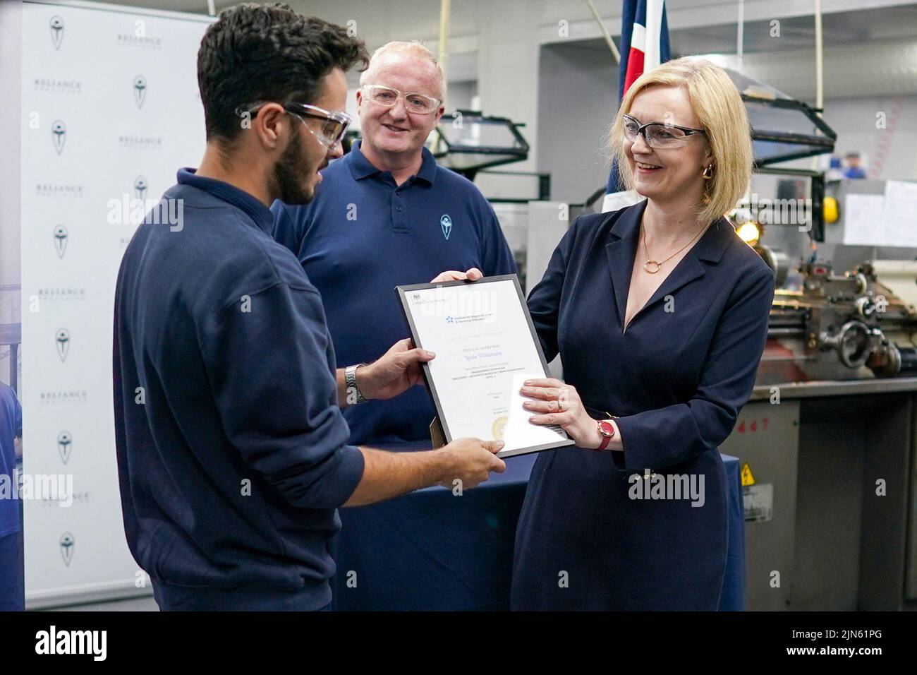 Britain's Conservative Party leadership candidate Liz Truss meets apprentices during a visit to the Reliance Precision engineering company ahead of a hustings event later, in Huddersfield, Britain August 9, 2022. Ian Forsyth/Pool via REUTERS Stock Photo