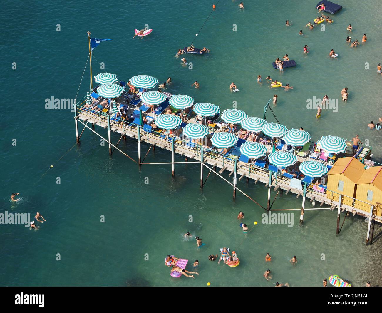 The coast is very rocky at Sorrento and there is almost no beach, so for enjoying the sea people use piers like this one. Sorrento, Campania, Italy Stock Photo