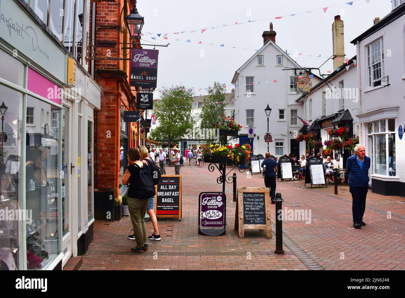 A bustling street scene with holidaymakers in the centre of Sidmouth