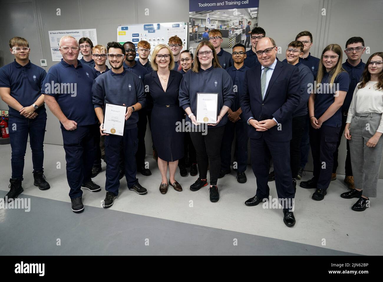 Britain's Conservative Party leadership candidate Liz Truss and British Defence Secretary Ben Wallace meet apprentices as they visit the Reliance Precision engineering company ahead of a hustings event later, in Huddersfield, Britain August 9, 2022. Ian Forsyth/Pool via REUTERS Stock Photo