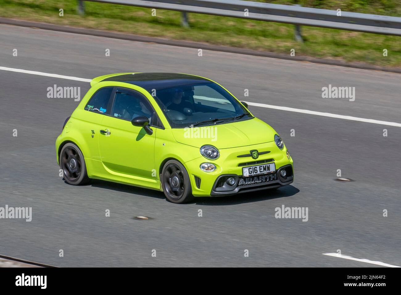 2018 Green ABARTH 595 TROFEO T-jet 160 1368cc 5-speed manual hatchback; travelling on the M6 motorway, UK Stock Photo