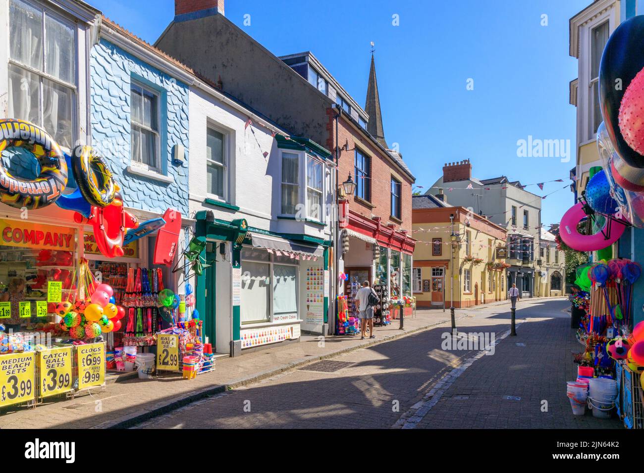 Colourful bucket and spade shops in St George's Street in Tenby, Pembrokeshire, Wales, UK Stock Photo