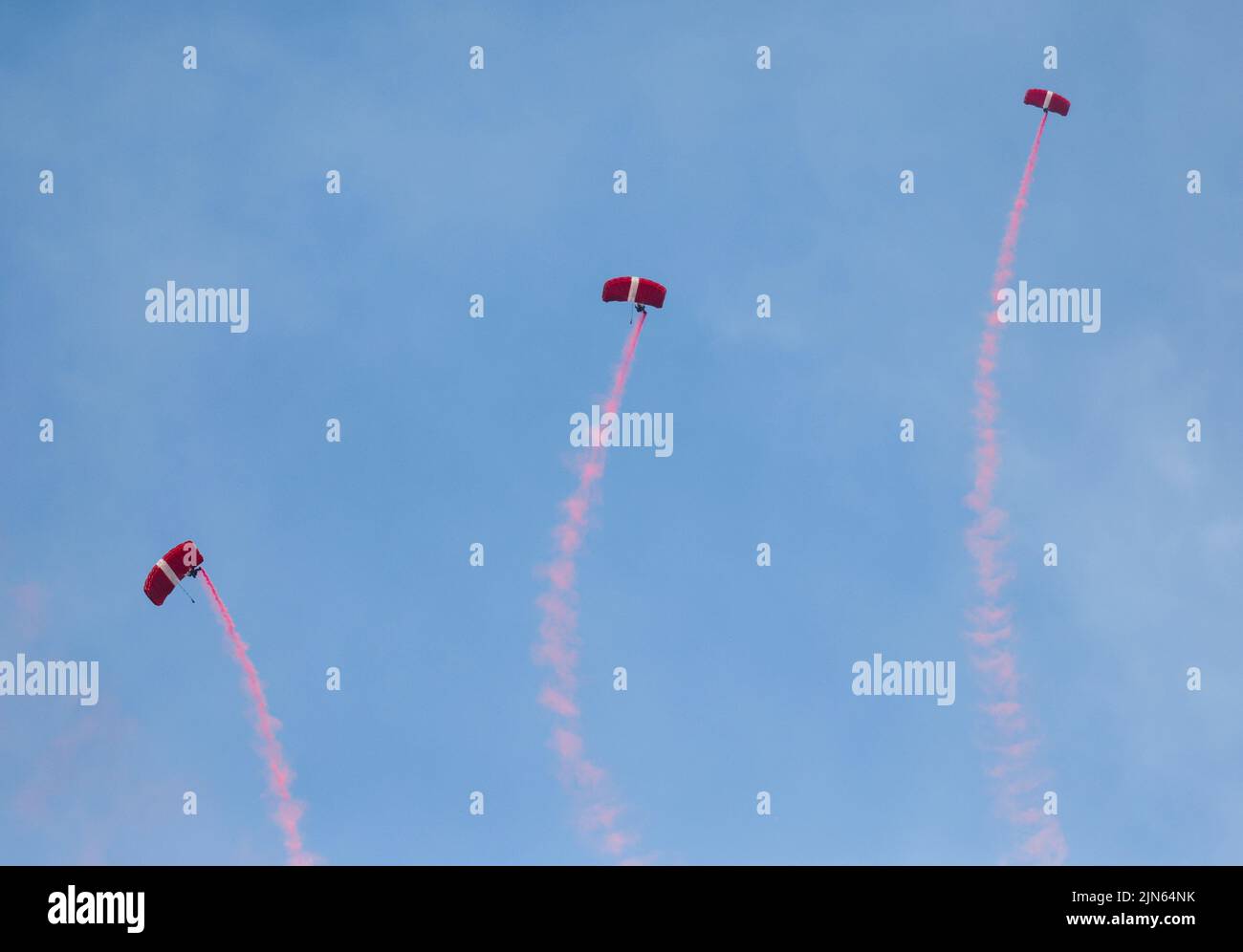 Singapore Armed Forces Red Lions parachute team perform over Marina Bay during National Day celebrations in Singapore August 9, 2022. REUTERS/Edgar Su Stock Photo