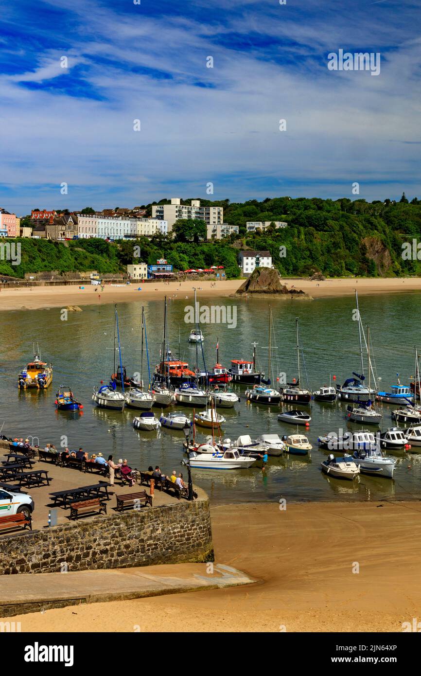 Looking across the picturesque sheltered harbour, towards the North Beach and Goscar Rock in Tenby, Pembrokeshire, Wales, UK Stock Photo