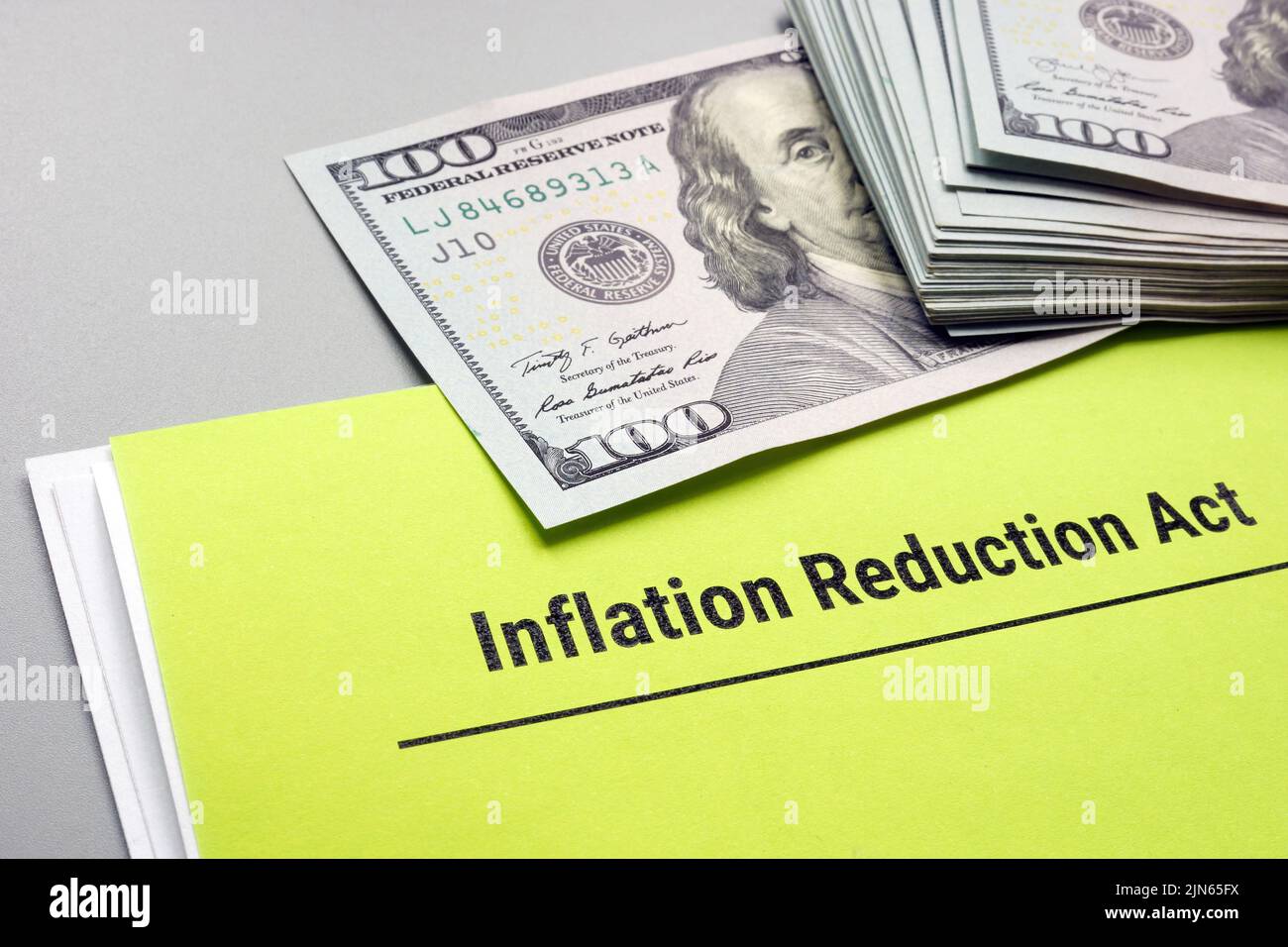 The Inflation Reduction Act of 2022 and cash on it. Stock Photo