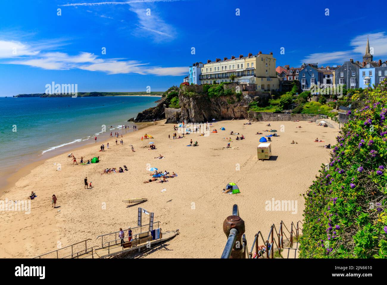 Colourful Georgian architecture overlooking Castle Beach in Tenby, Pembrokeshire, Wales, UK Stock Photo