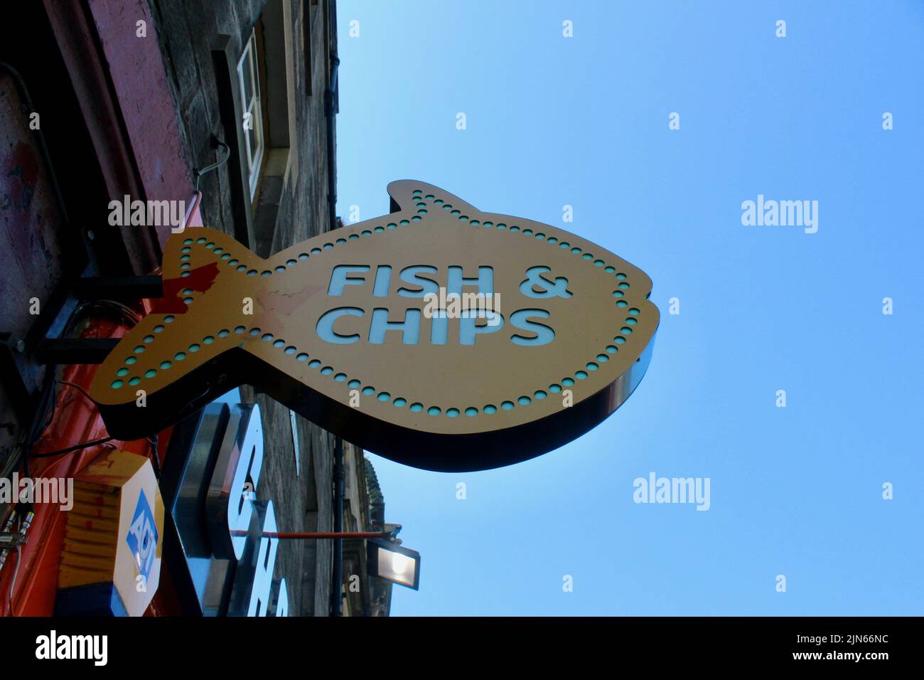 a fish shaped fish and chip advertising sign in edinburgh scotland Stock Photo